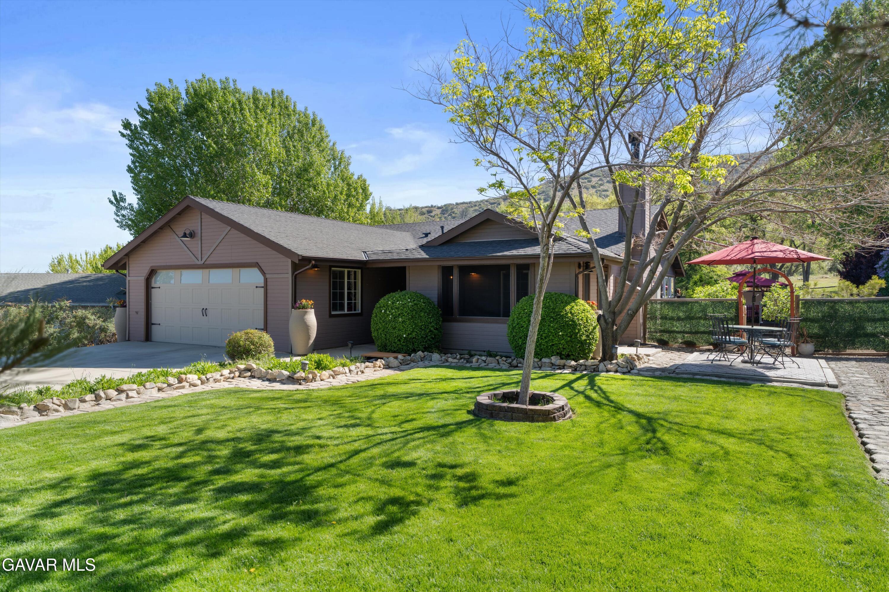 18250 Arosa Road Tehachapi, CA 93561 - Photo 67 of 71 a view of a house with backyard porch and sitting area