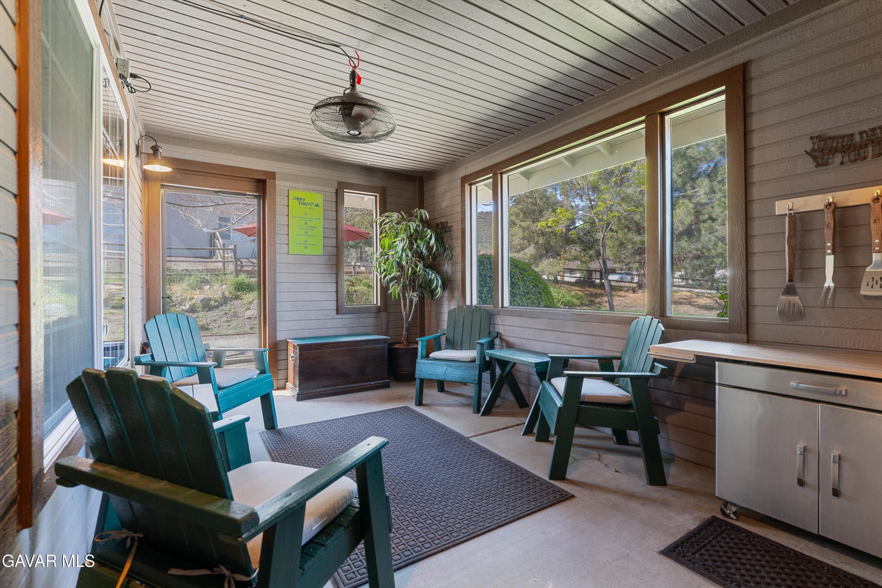 18250 Arosa Road Tehachapi, CA 93561 - Photo 7 of 71 a living room with furniture a ceiling fan and a large window