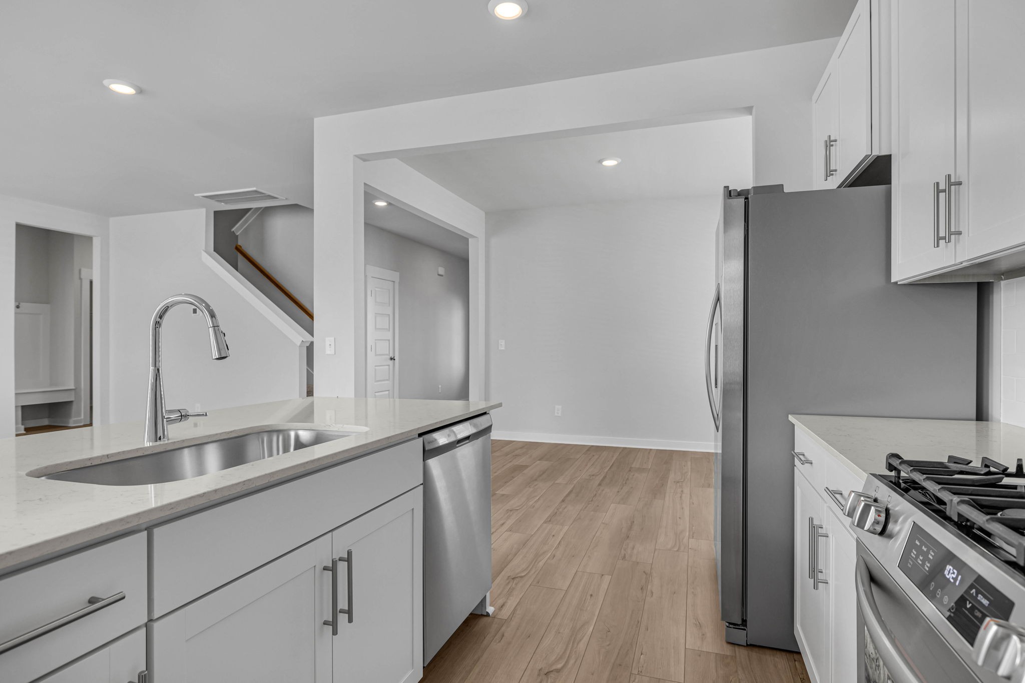 219 Goldfinch Road Mount Juliet, TN 37122 - Photo 13 of 58 a kitchen with stainless steel appliances granite countertop a sink stove and refrigerator