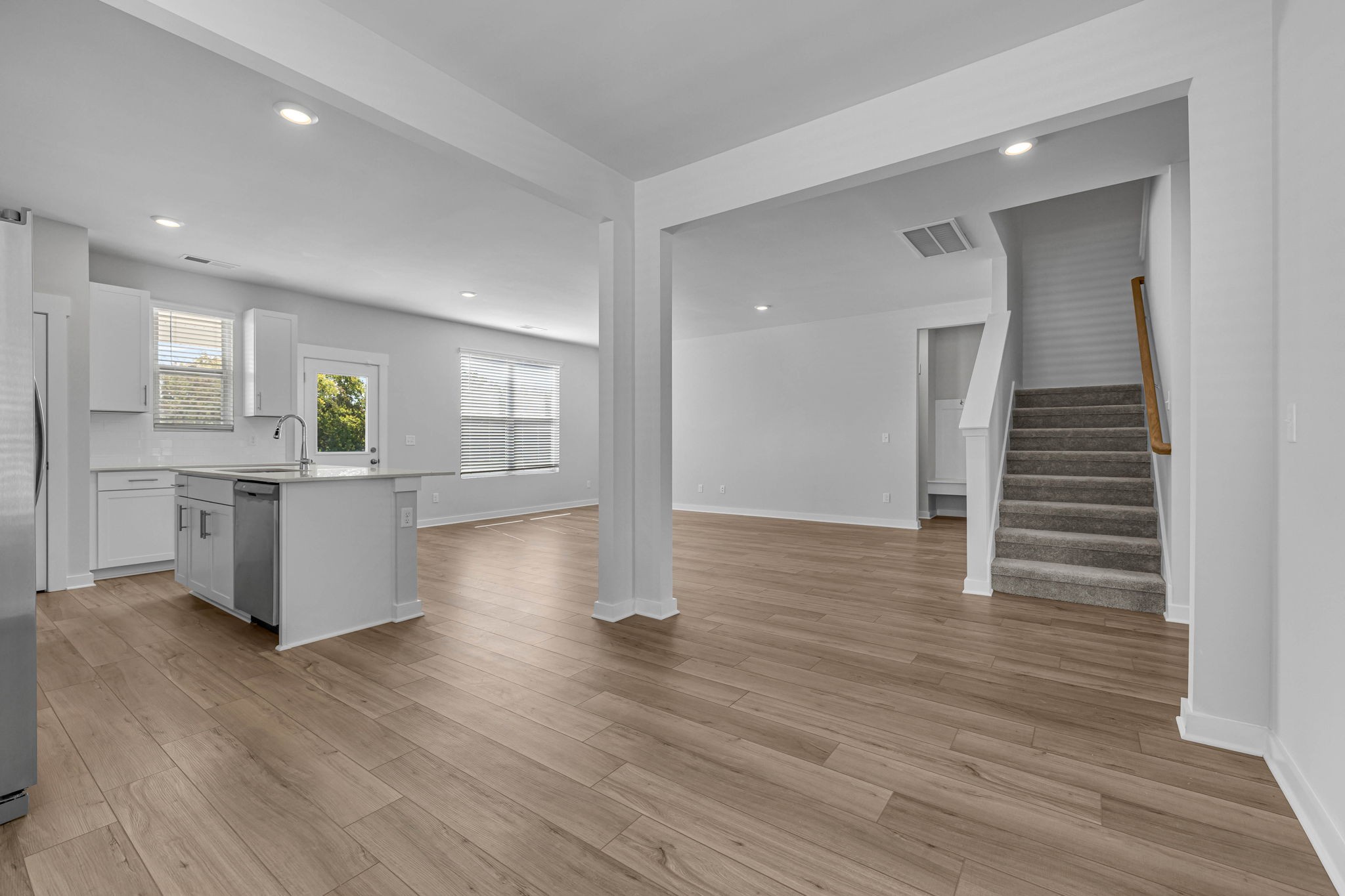 219 Goldfinch Road Mount Juliet, TN 37122 - Photo 14 of 58 a view of a kitchen with wooden floor and electronic appliances