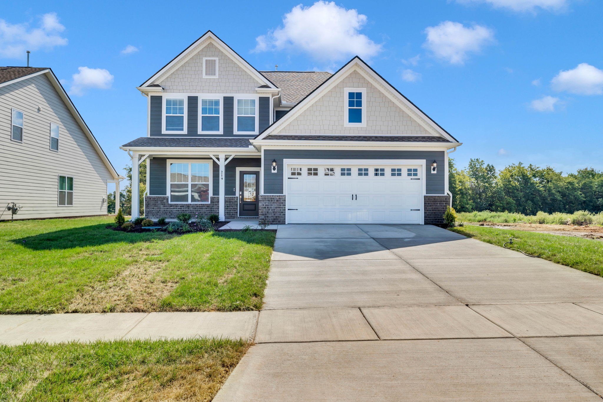 219 Goldfinch Road Mount Juliet, TN 37122 - Photo 2 of 58 a front view of a house with a garden and deck