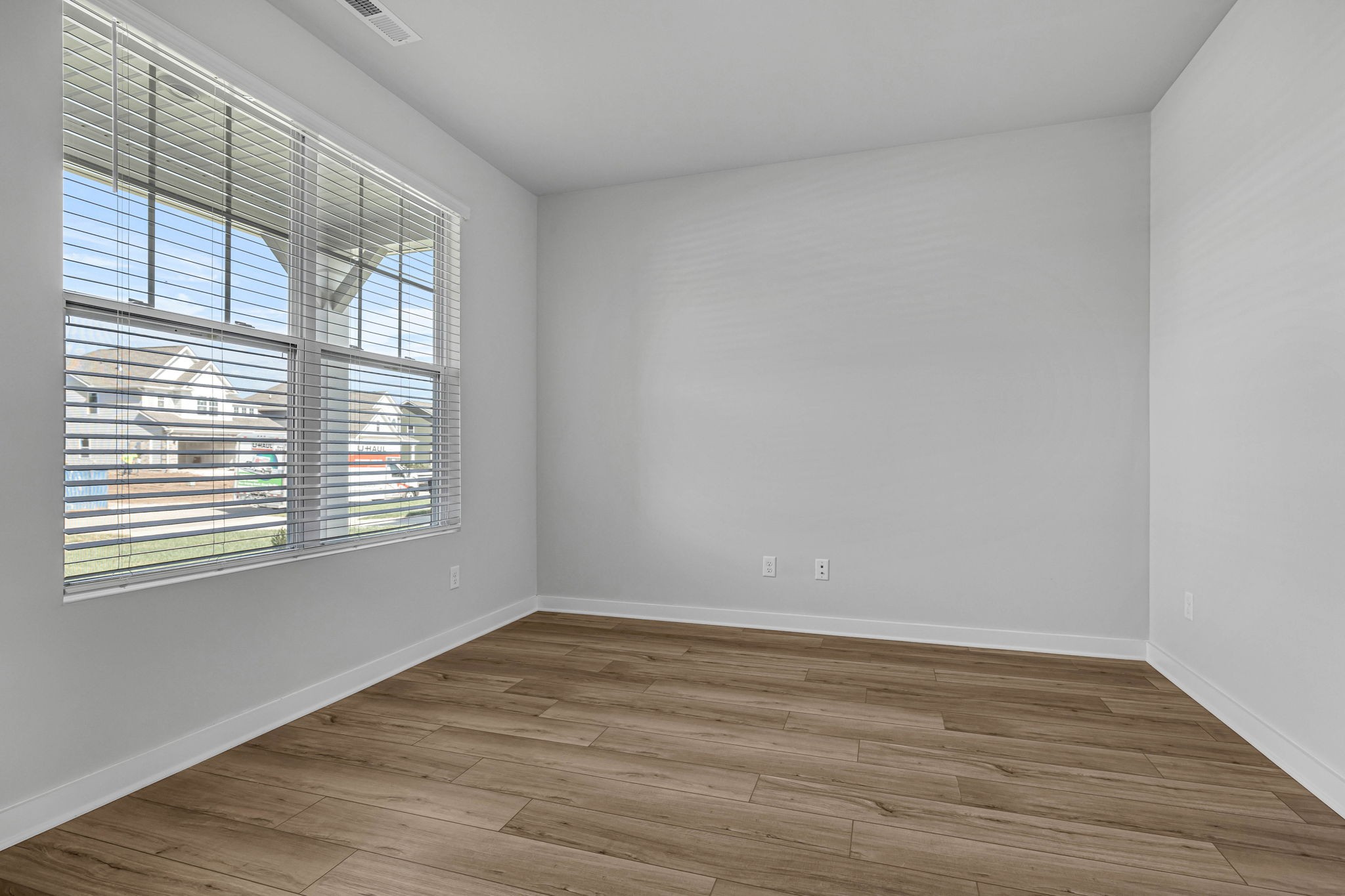 219 Goldfinch Road Mount Juliet, TN 37122 - Photo 27 of 58 a view of an empty room with wooden floor and a window