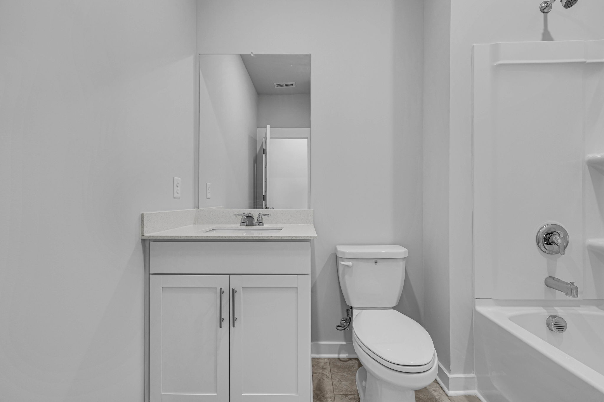 219 Goldfinch Road Mount Juliet, TN 37122 - Photo 33 of 58 a bathroom with a toilet a sink a mirror and vanity