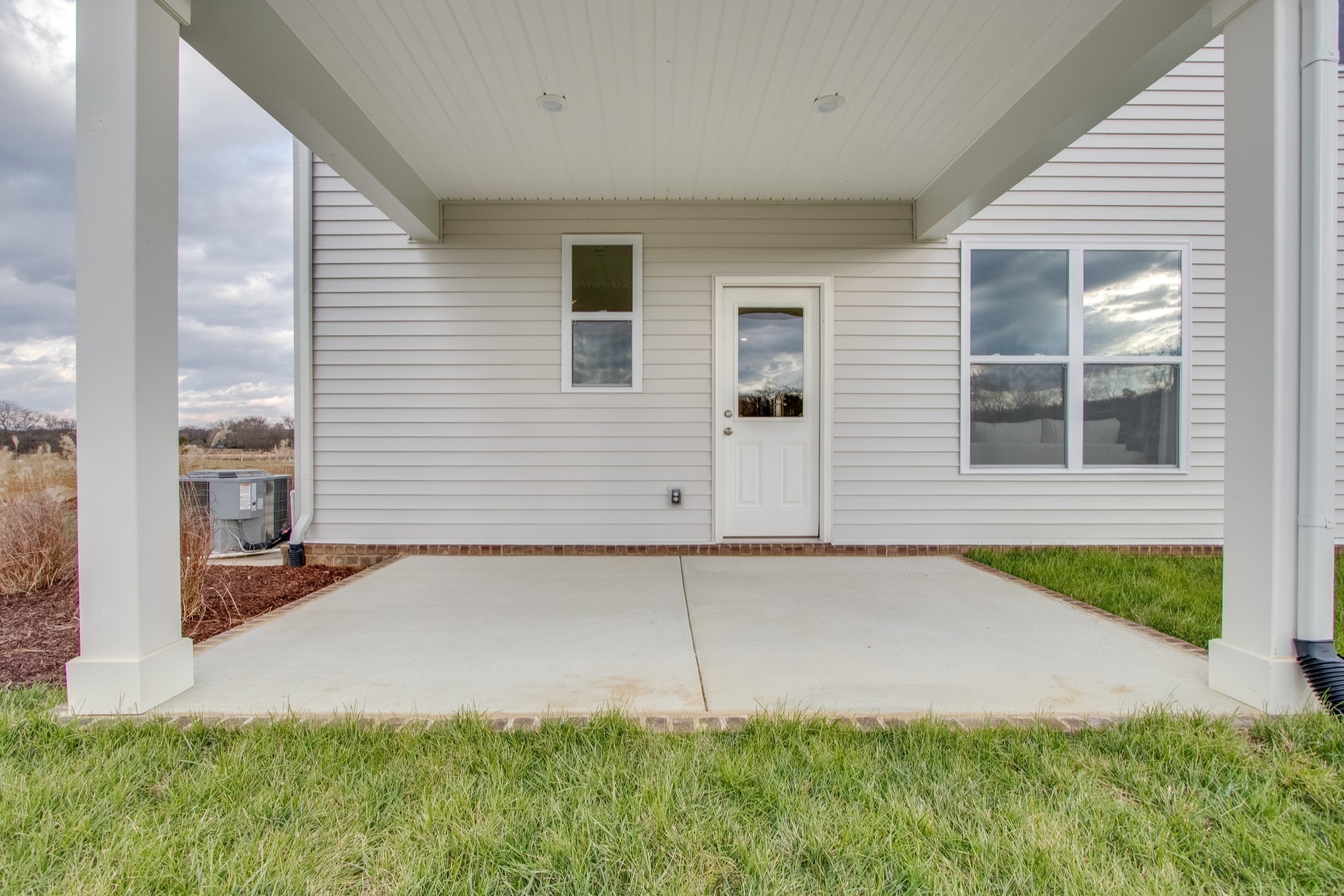 219 Goldfinch Road Mount Juliet, TN 37122 - Photo 54 of 58 a backyard of a house with barbeque oven and plants