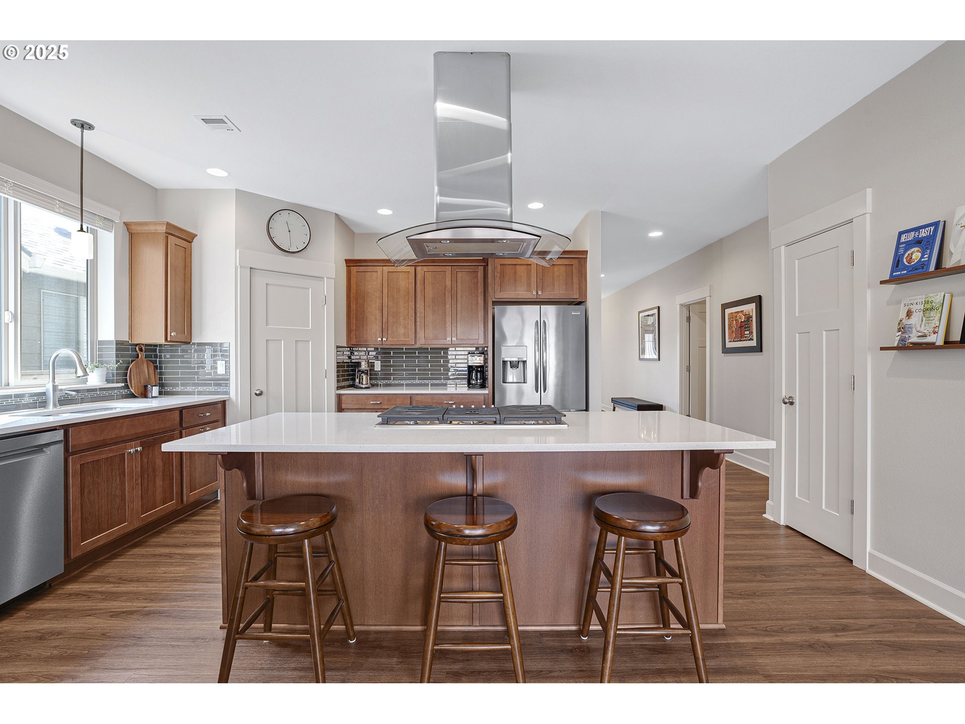 3571 Southwest 31st Street Gresham, OR 97080 - Photo 13 of 37 a kitchen with stainless steel appliances a table and chairs in it