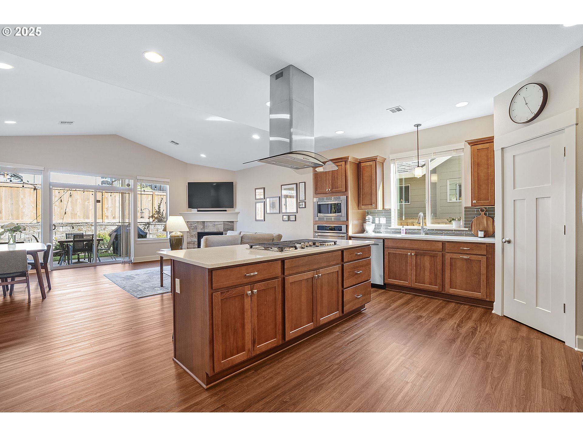 3571 Southwest 31st Street Gresham, OR 97080 - Photo 15 of 37 a kitchen with stainless steel appliances granite countertop wooden floors and view living room