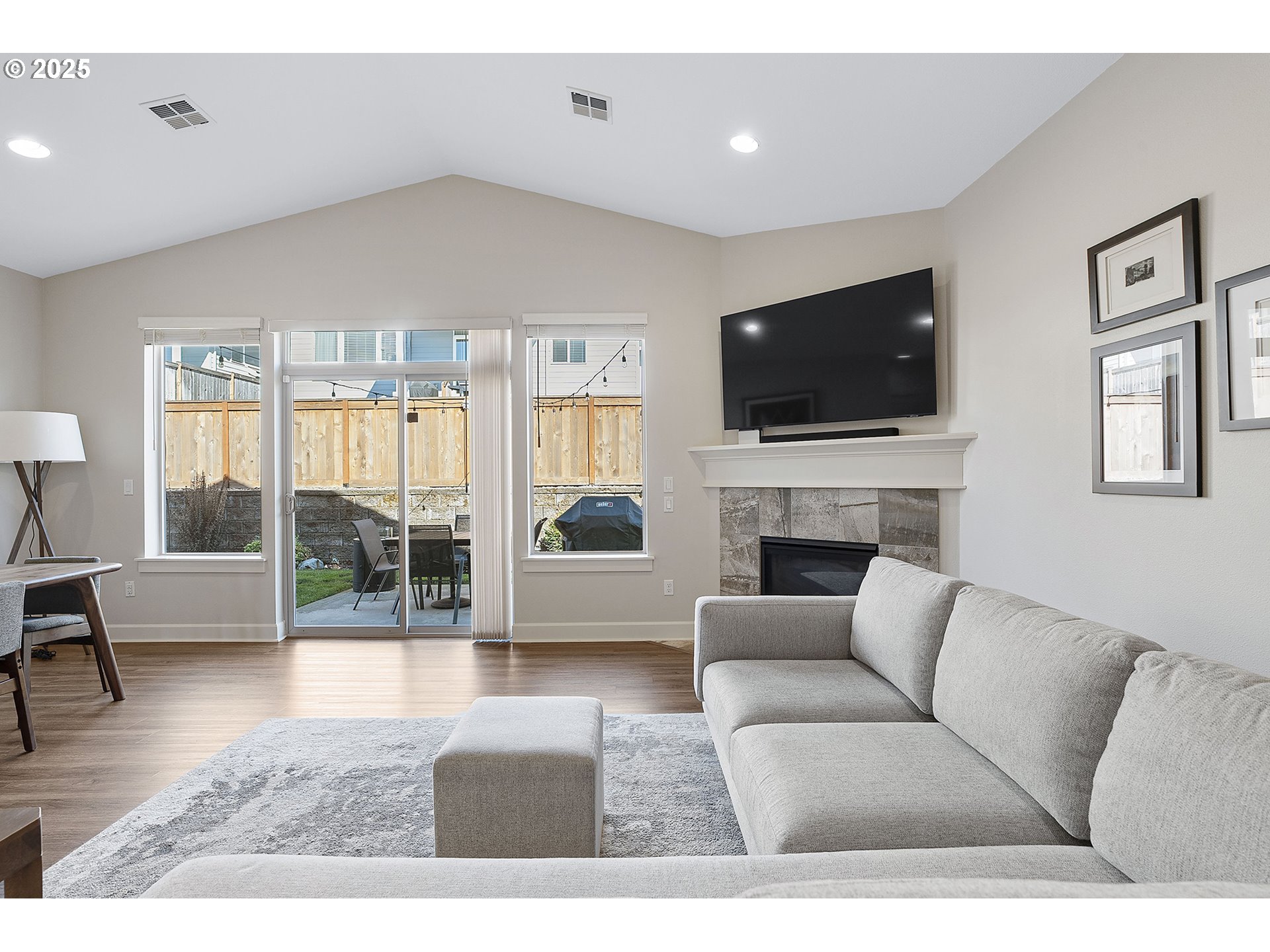 3571 Southwest 31st Street Gresham, OR 97080 - Photo 20 of 37 a living room with furniture a flat screen tv and a fireplace