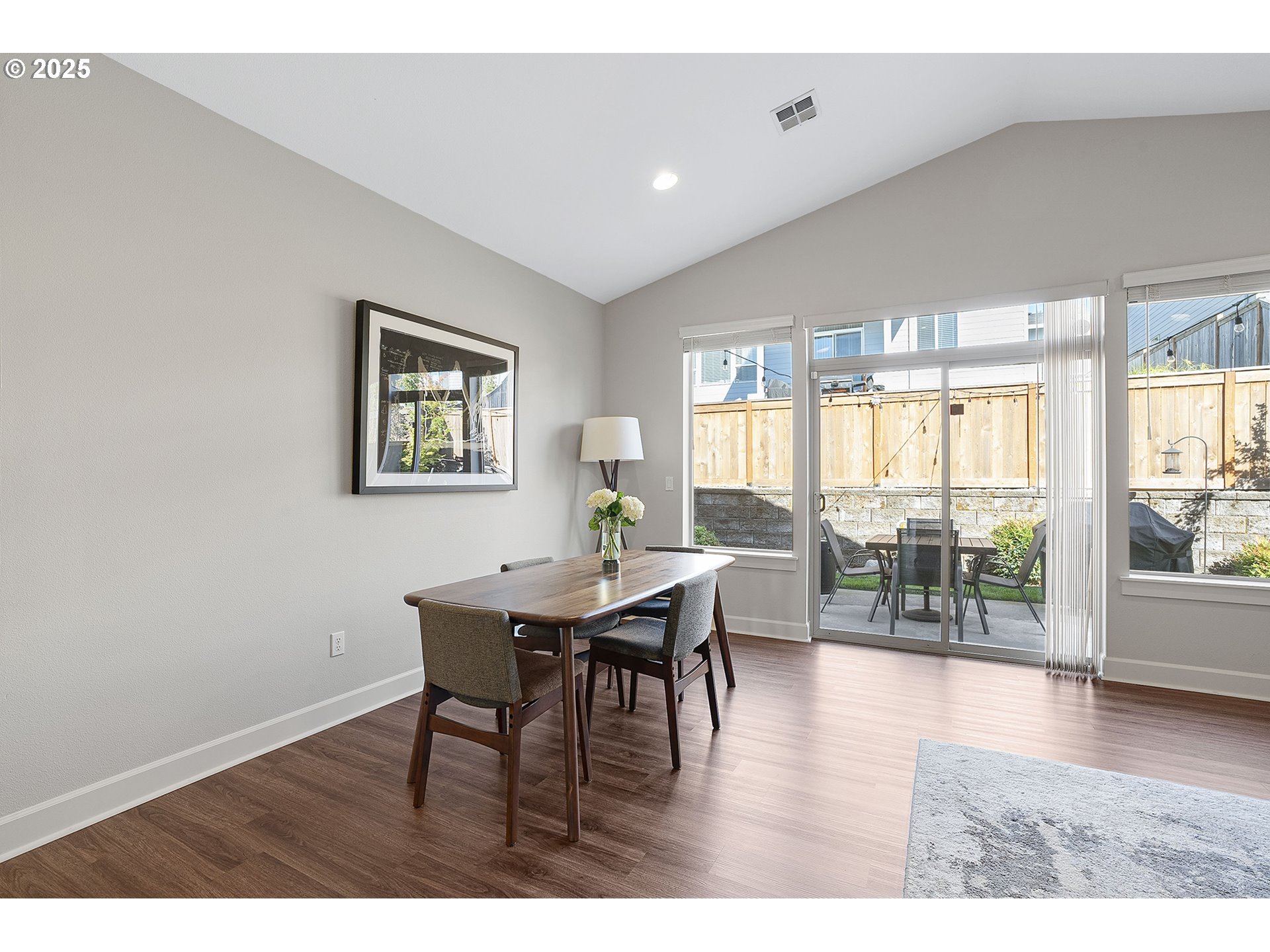 3571 Southwest 31st Street Gresham, OR 97080 - Photo 21 of 37 a living room with furniture a wooden floor and a large window