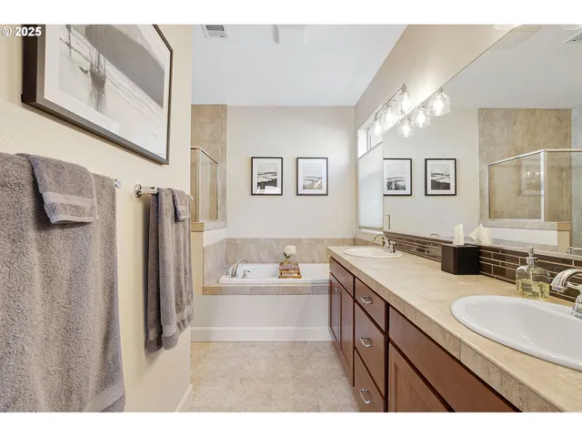 a bathroom with a sink double vanity and a mirror