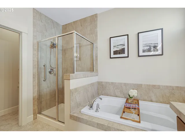 a bathroom with a tub shower and sink