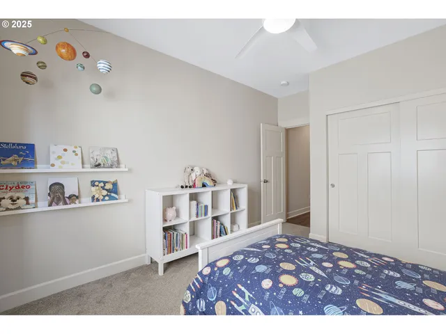 a bedroom with a bed and closet