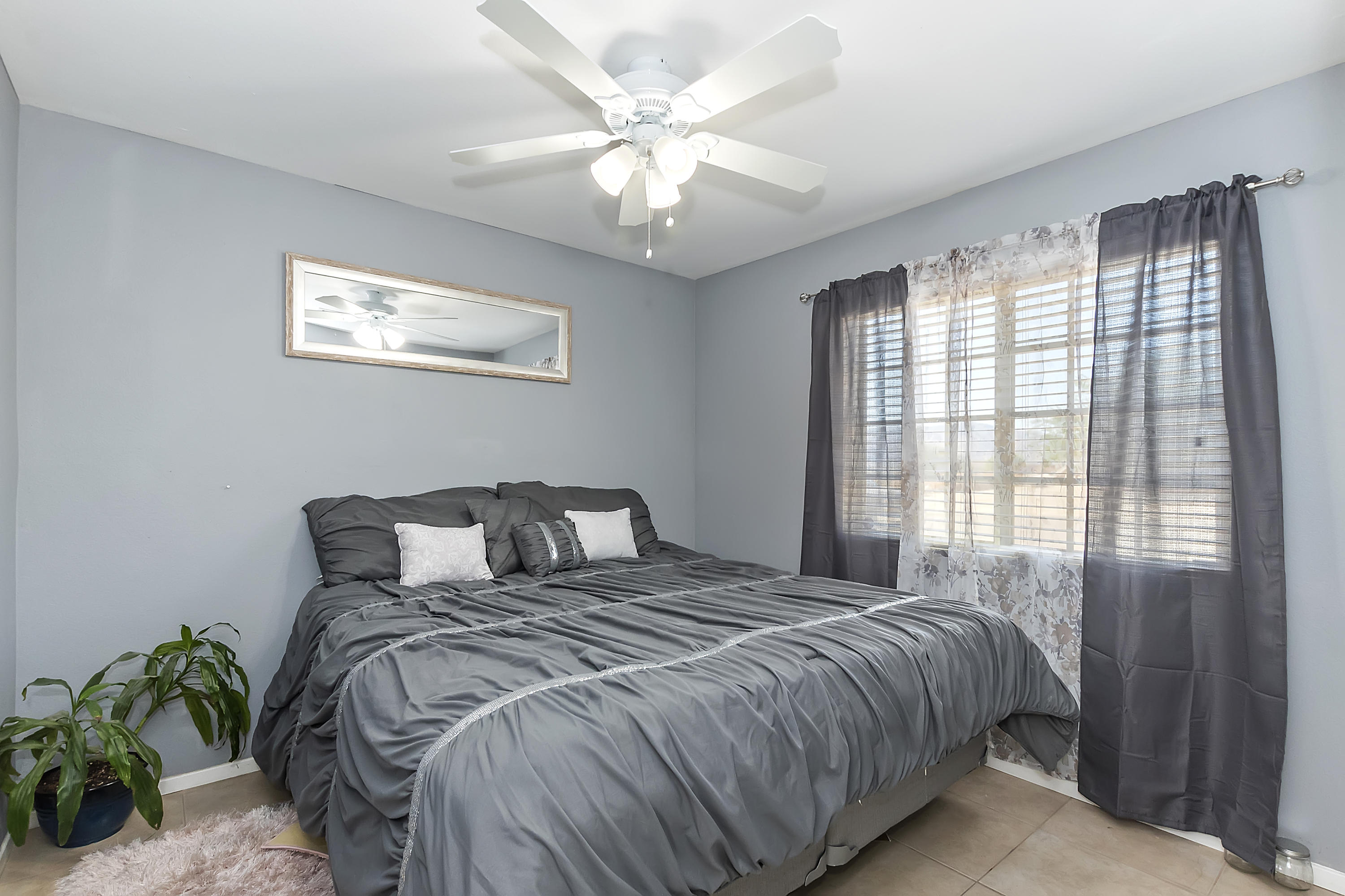 13140 Zane Way Whitewater, CA 92282 - Photo 13 of 25 a bedroom with a bed and a window