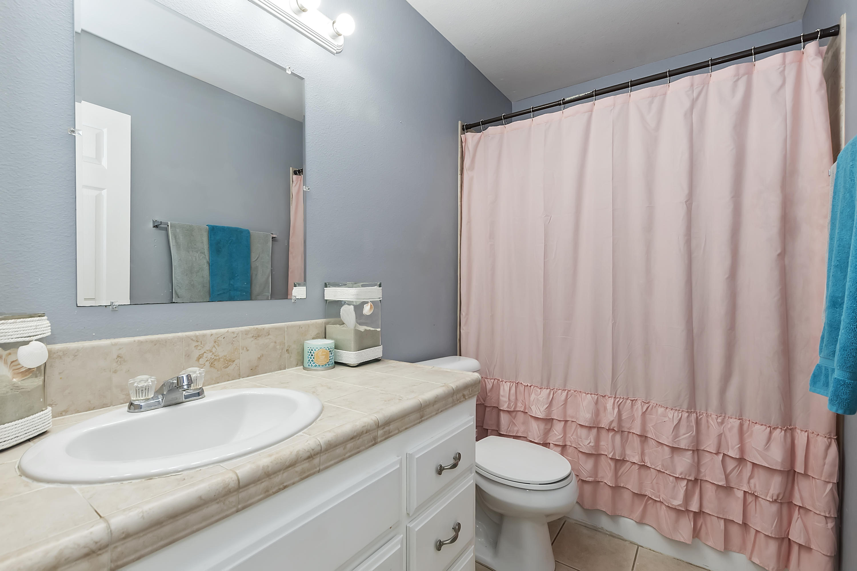 13140 Zane Way Whitewater, CA 92282 - Photo 14 of 25 a bathroom with a granite countertop sink a toilet and a mirror
