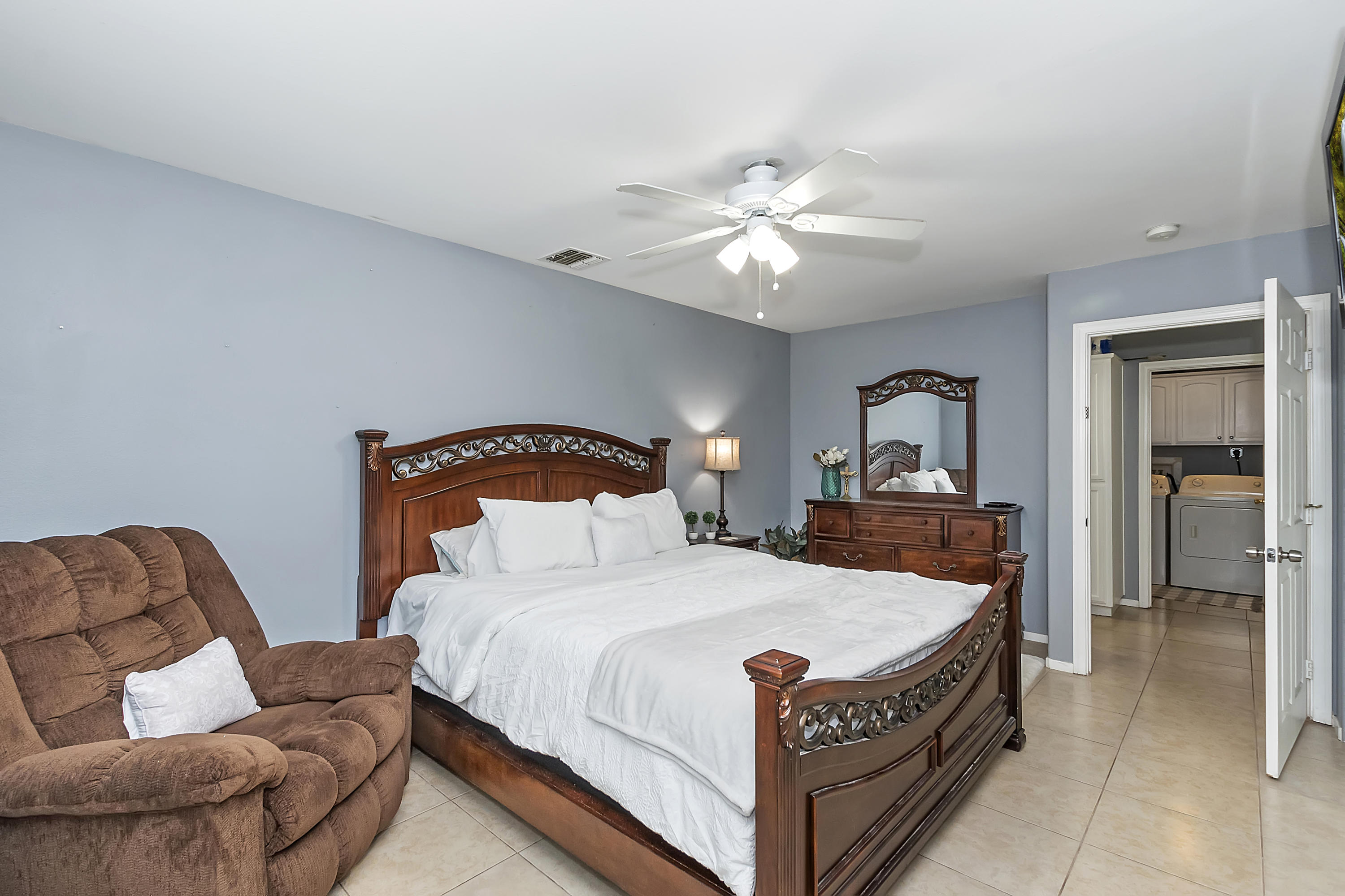 13140 Zane Way Whitewater, CA 92282 - Photo 18 of 25 a bedroom with a bed and a couch