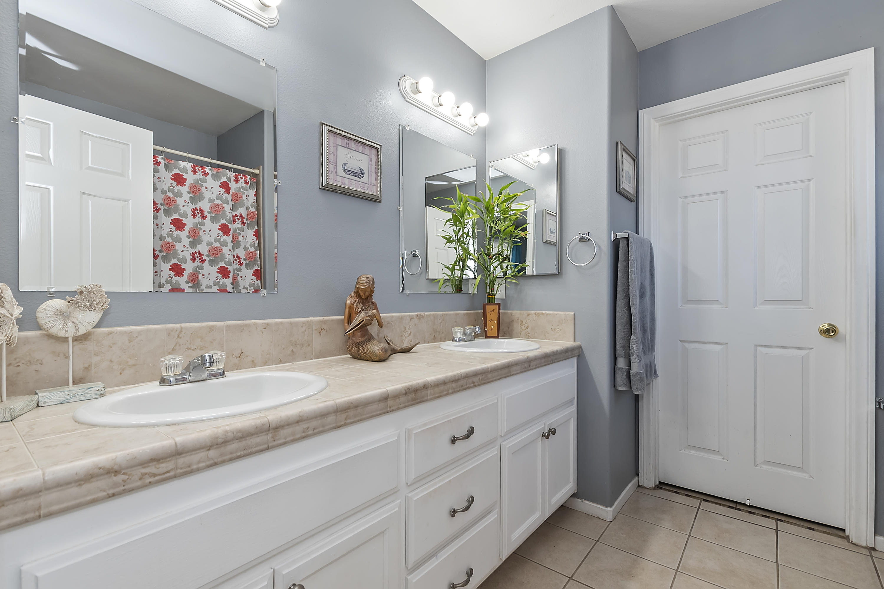 13140 Zane Way Whitewater, CA 92282 - Photo 20 of 25 a bathroom with a granite countertop sink and a mirror