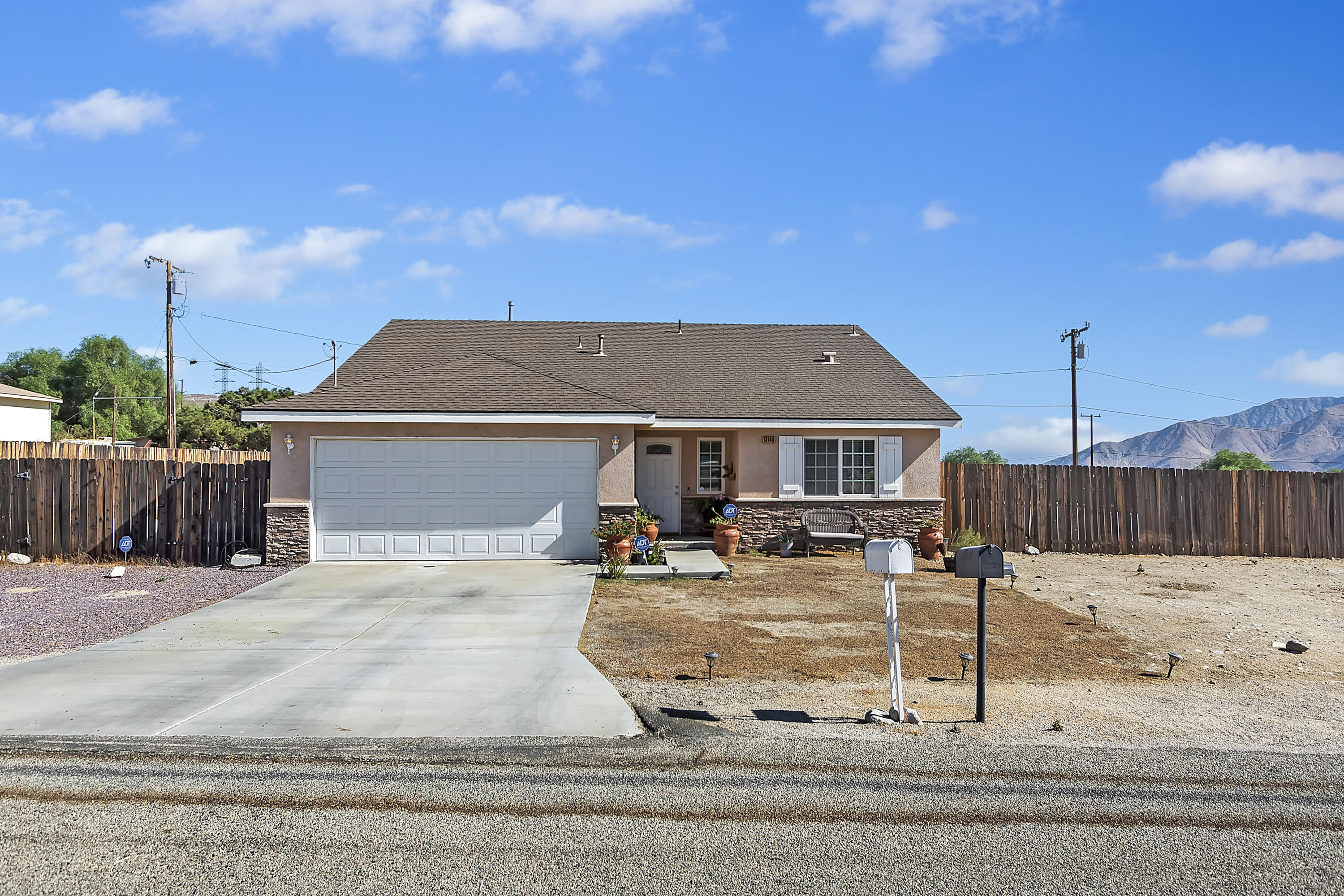 13140 Zane Way Whitewater, CA 92282 - Photo 3 of 25 a view of a house with sitting area and roof