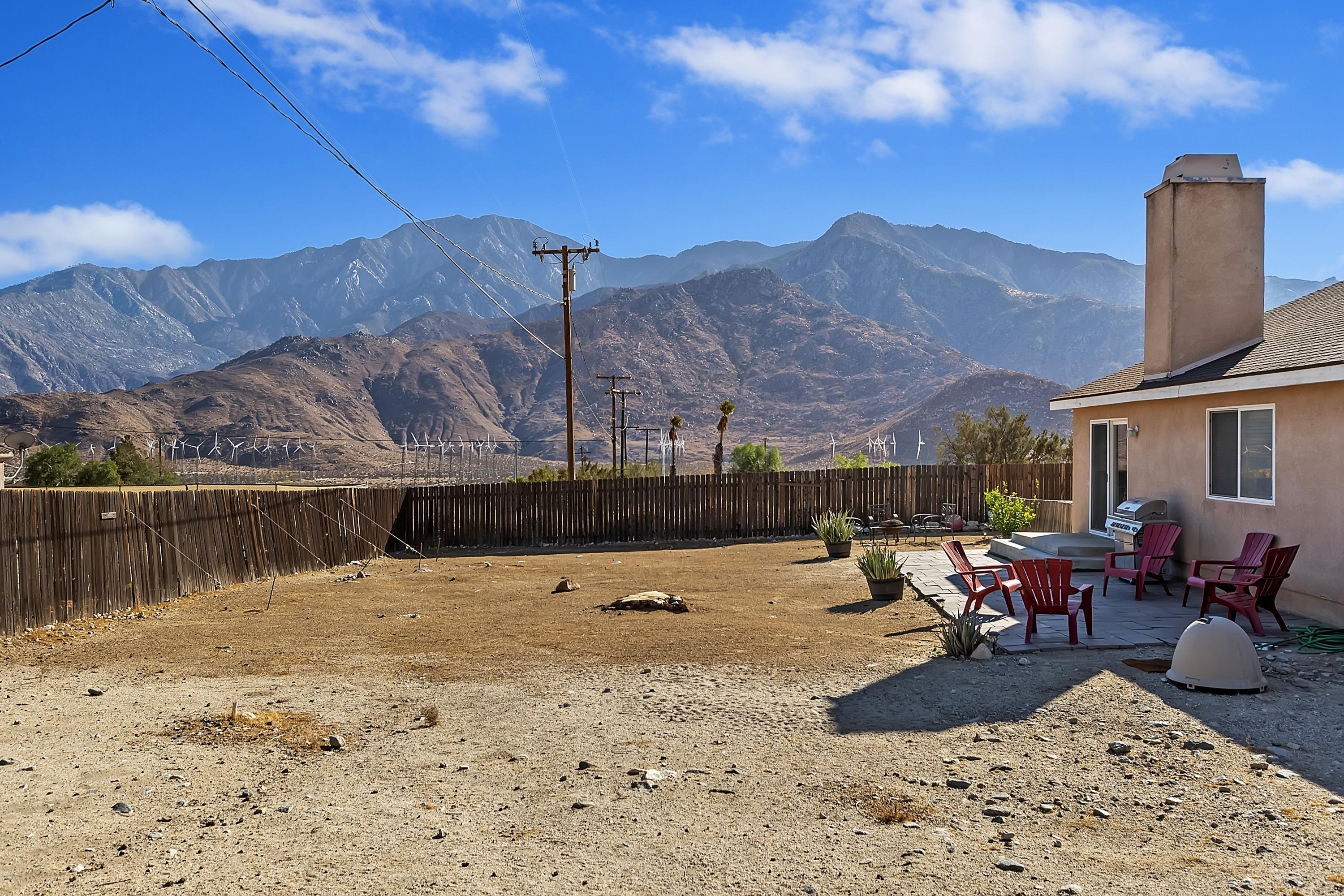 13140 Zane Way Whitewater, CA 92282 - Photo 23 of 25 a view of a lake with couches and wooden fence