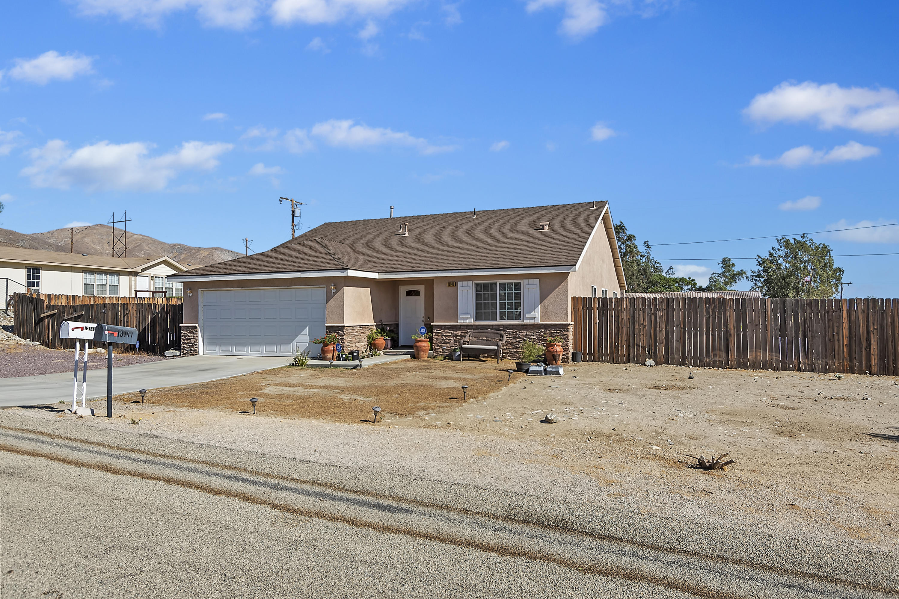 13140 Zane Way Whitewater, CA 92282 - Photo 5 of 25 a view of house with yard and staircase