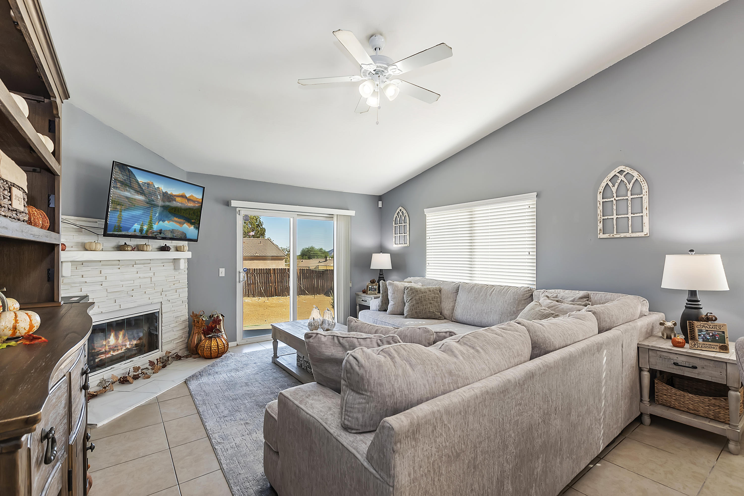 13140 Zane Way Whitewater, CA 92282 - Photo 7 of 25 a living room with furniture fireplace and a flat screen tv