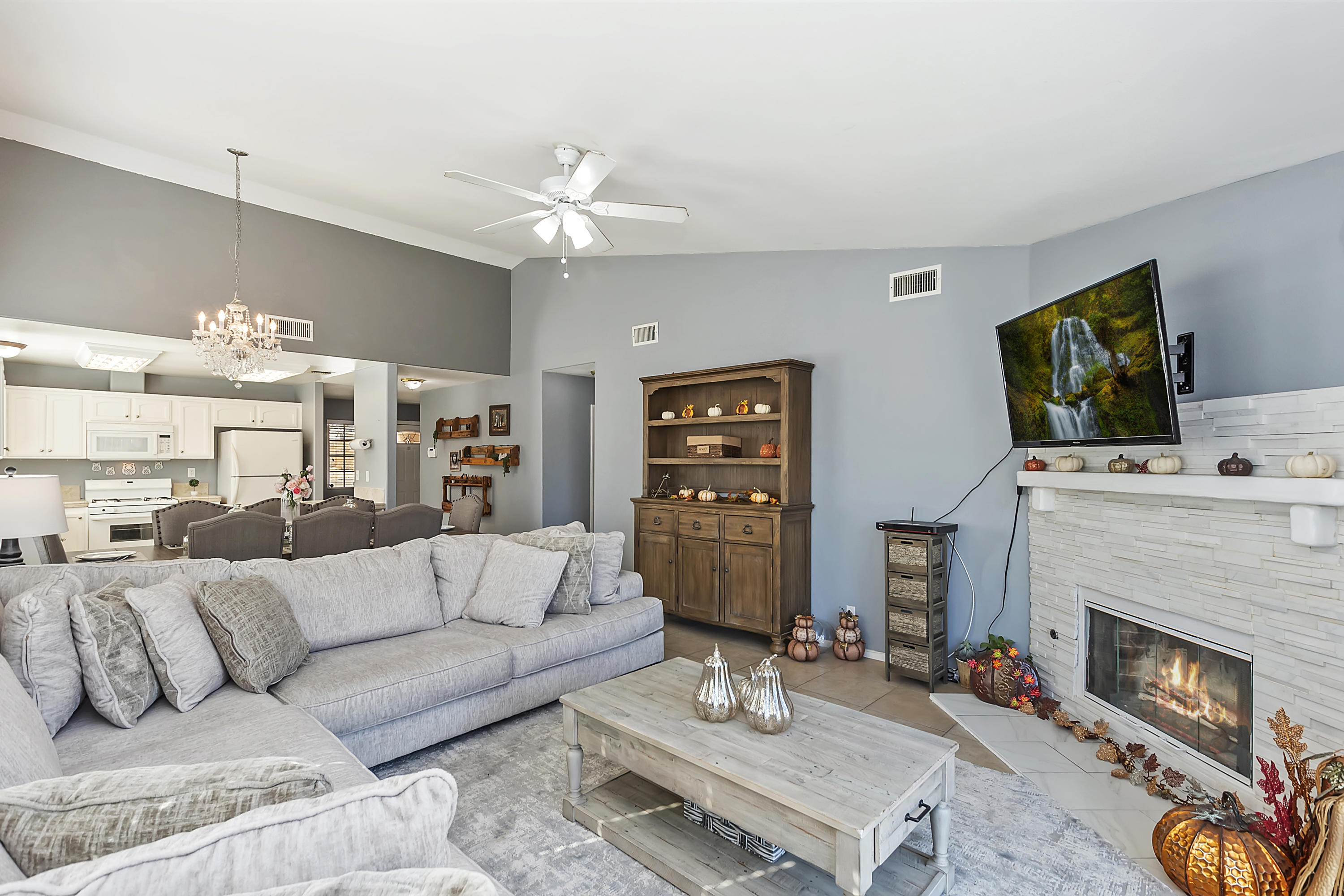 13140 Zane Way Whitewater, CA 92282 - Photo 8 of 25 a living room with furniture a fireplace and a flat screen tv