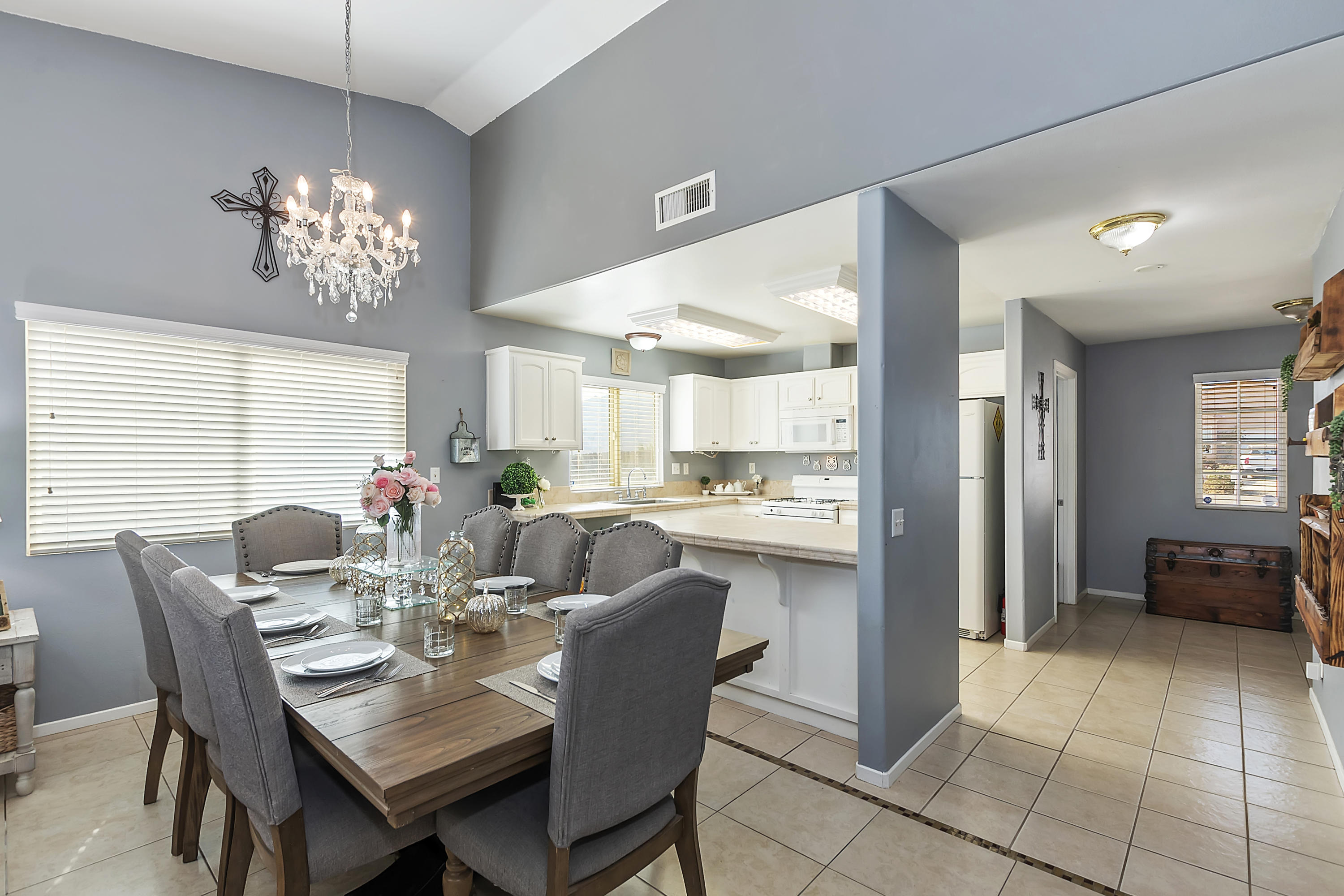 13140 Zane Way Whitewater, CA 92282 - Photo 9 of 25 a dining room with furniture a chandelier and kitchen view