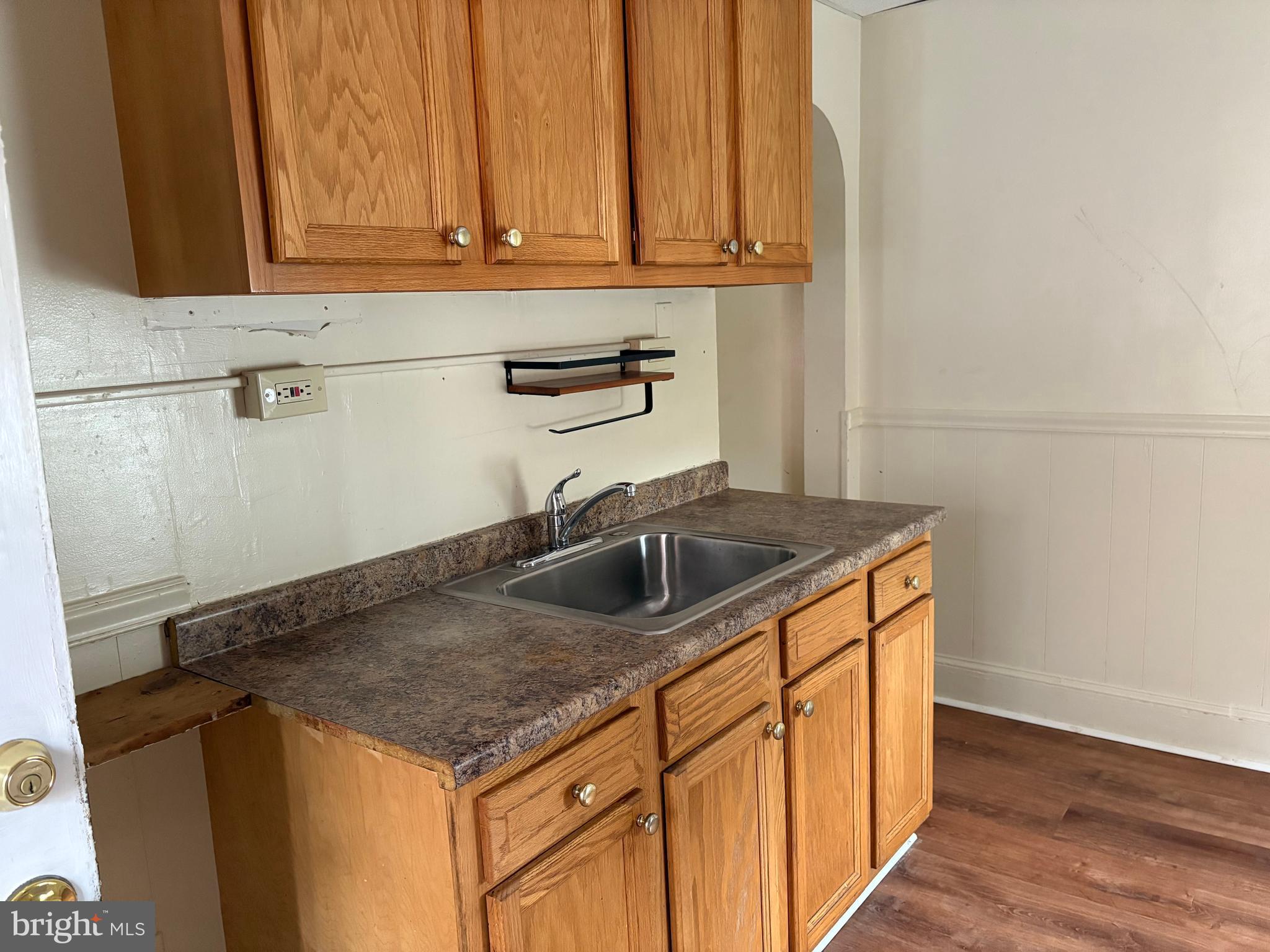 114 Strode Avenue Coatesville, PA 19320 - Photo 6 of 16 a kitchen with granite countertop a sink and a stove