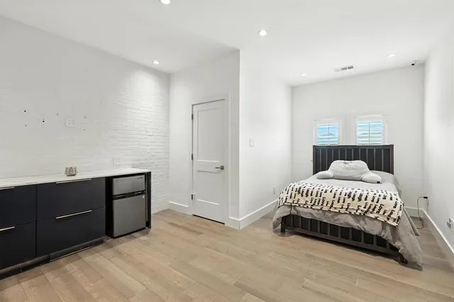a view of a house with backyard porch and sitting area