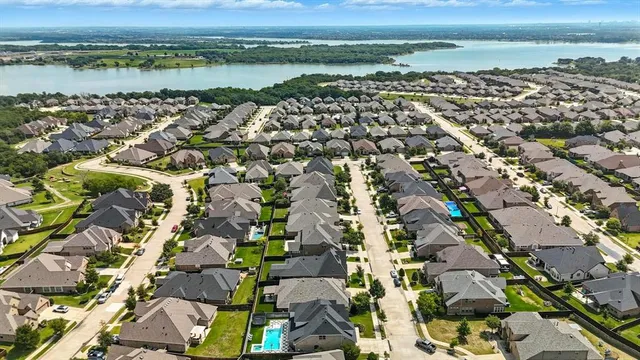 an aerial view of a city with ocean view
