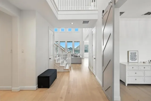 a view of a living room with furniture and a large window