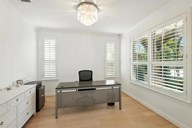 a living room with furniture and windows