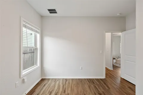 a bathroom with a bathtub shower sink vanity and toilet