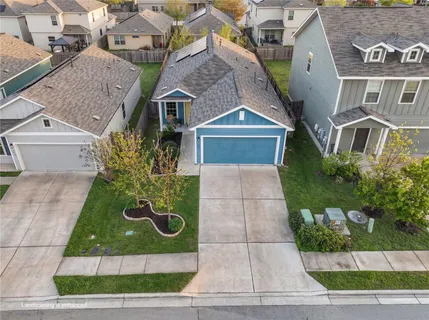 a aerial view of a house with a garden