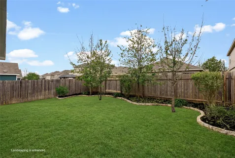 a backyard of a house with lots of green space
