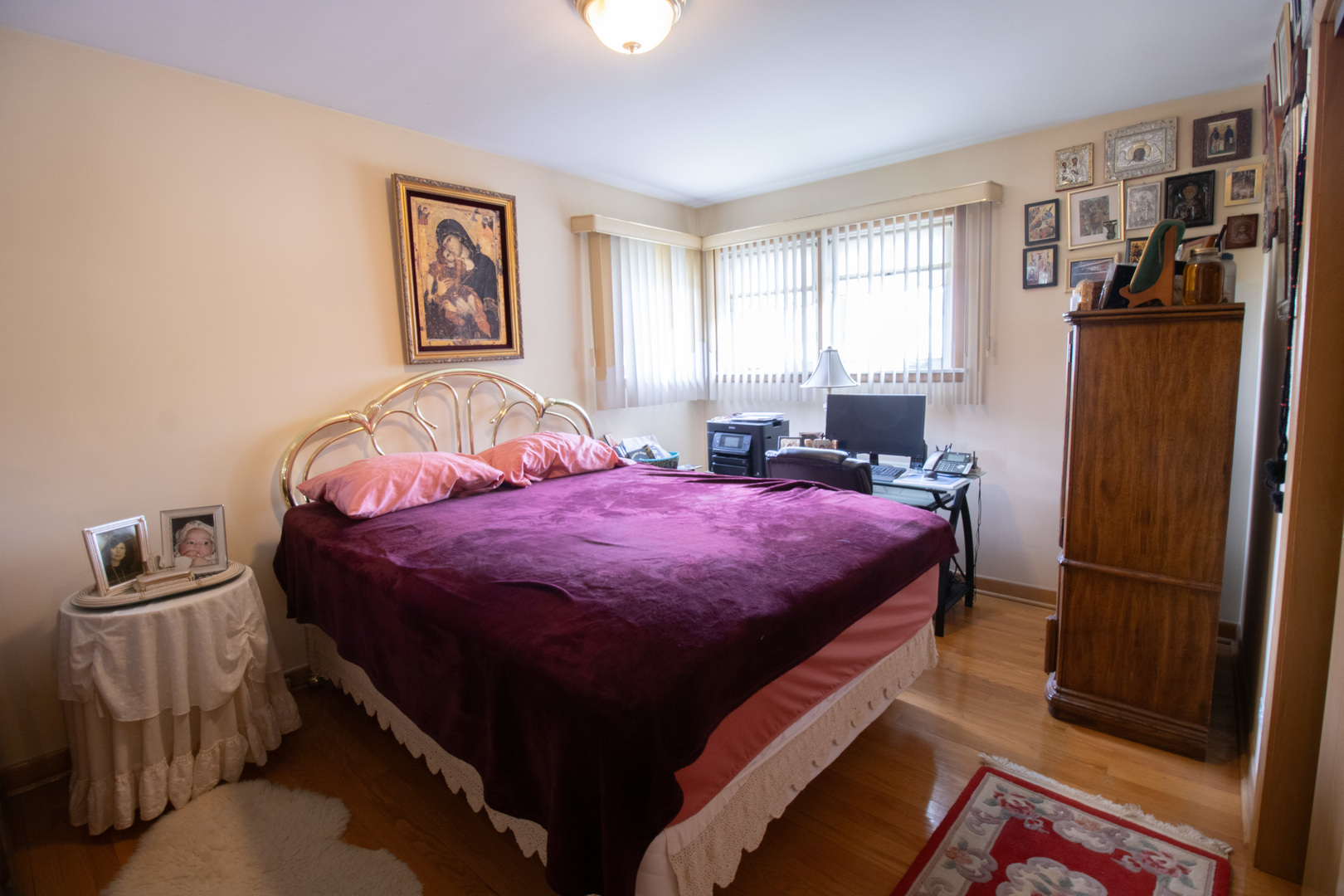 8662 North Merrill Street Niles, IL 60714 - Photo 16 of 27 a bedroom with a bed and a window