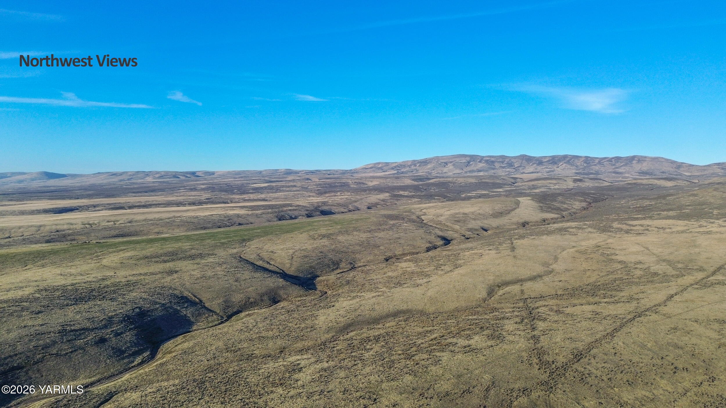 24 Moxee Wa 98936 Moxee, WA 98936 - Photo 10 of 16 a view of a lake with mountains in the background