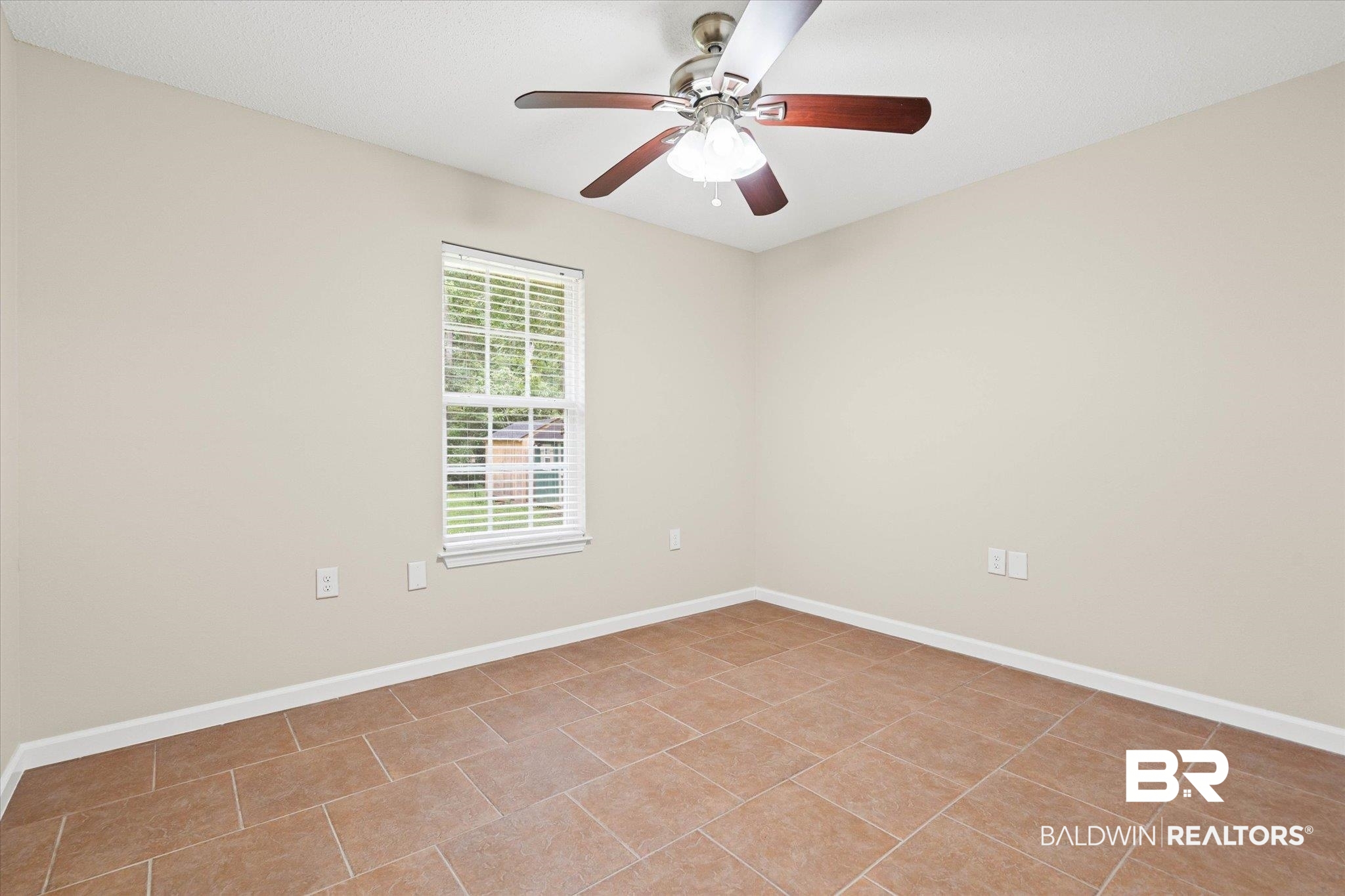 157 Bay View Drive Daphne, AL 36526 - Photo 13 of 22 Unfurnished room with light tile patterned floors and a ceiling fan