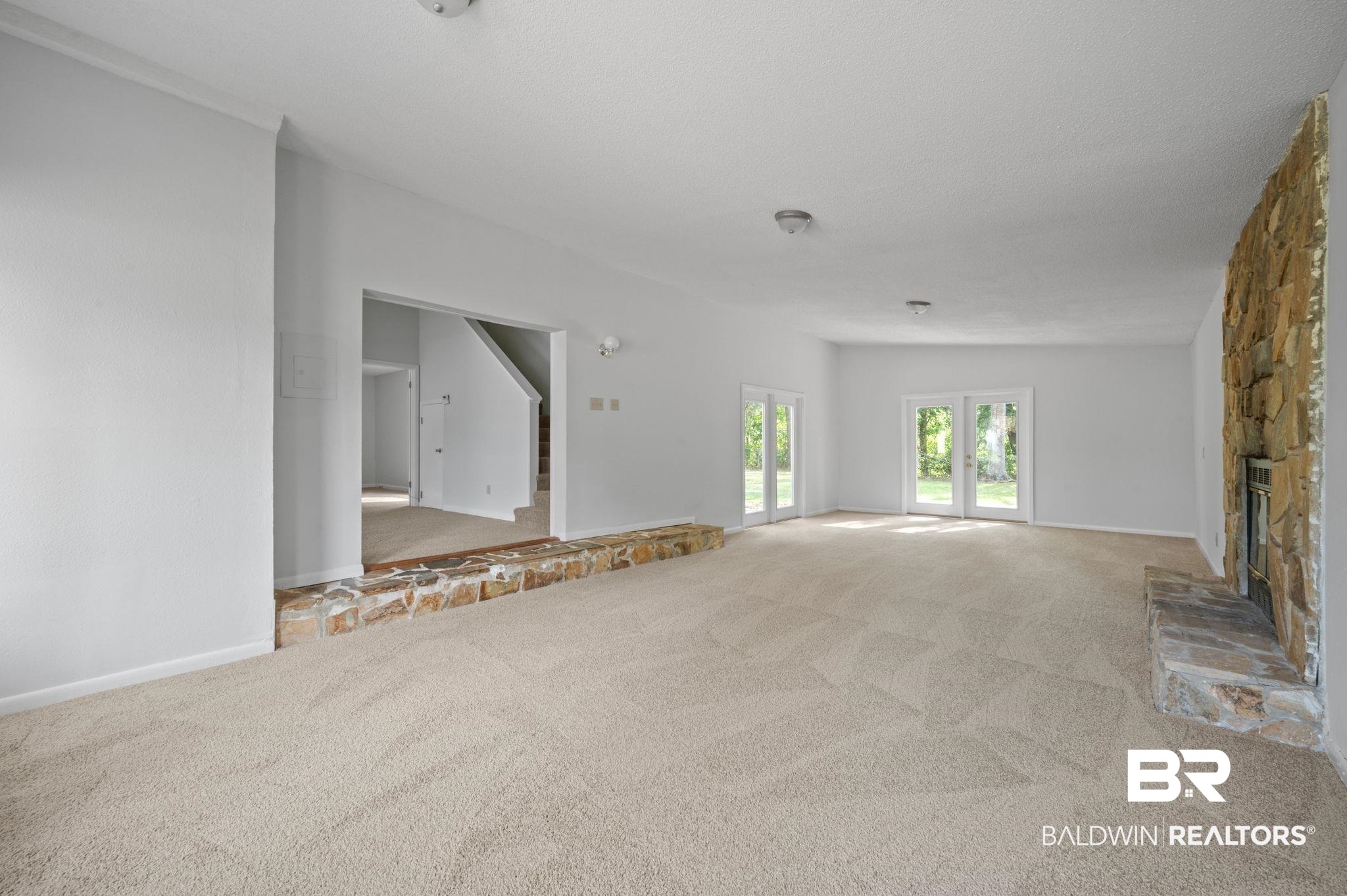 3701 Vista Ridge Drive Mobile, AL 36693 - Photo 20 of 33 Unfurnished living room with carpet and a fireplace