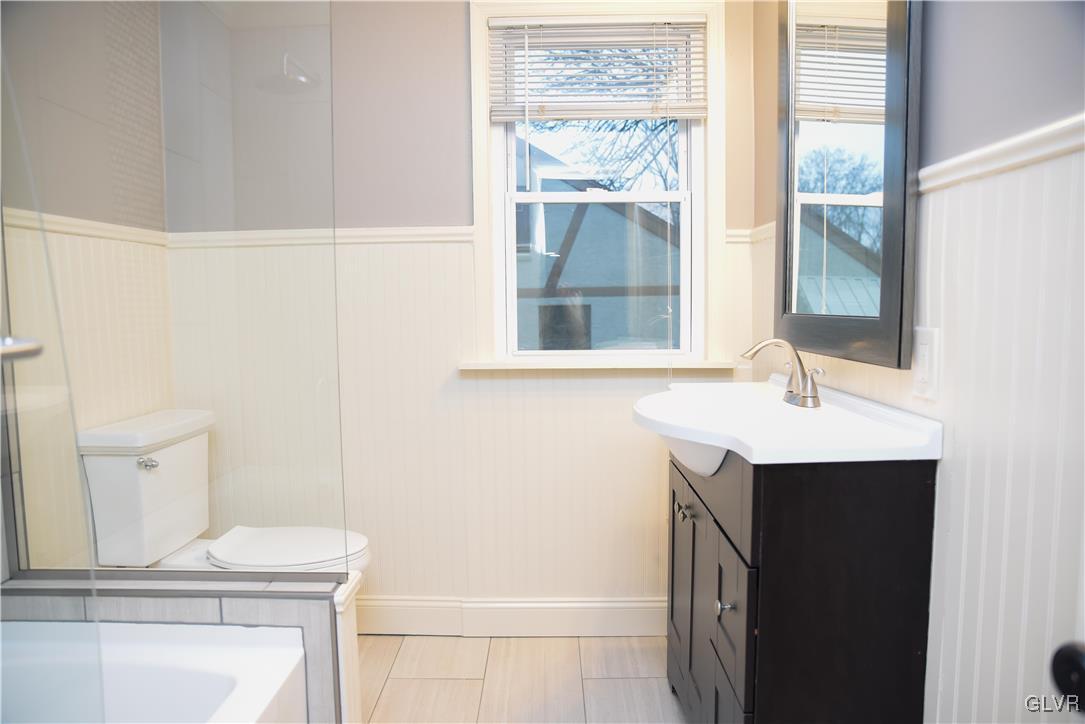 3151 Penn Dixie Road Nazareth, PA 18064 - Photo 16 of 44 a bathroom with a sink a toilet and a window