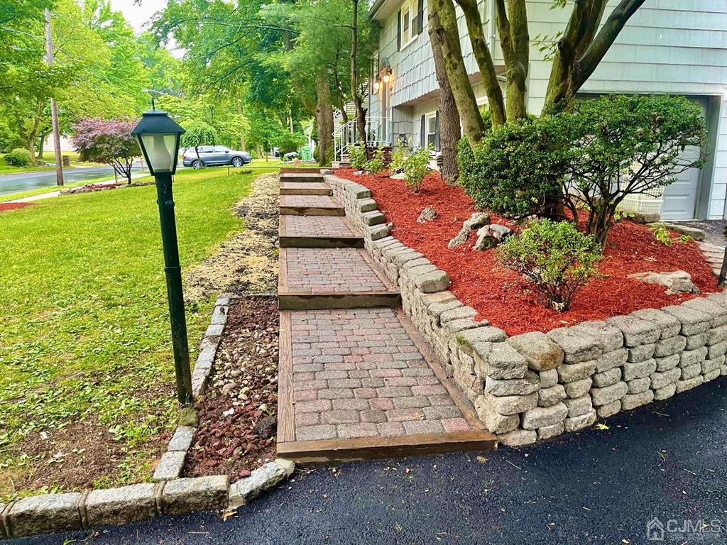 5 Greenwich Road Edison, NJ 08820 - Photo 2 of 52 a view of a garden with an outdoor space