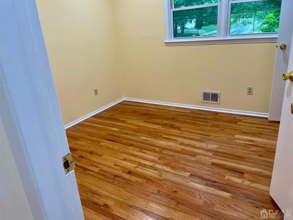 5 Greenwich Road Edison, NJ 08820 - Photo 25 of 52 a view of a room with wooden floor and a window