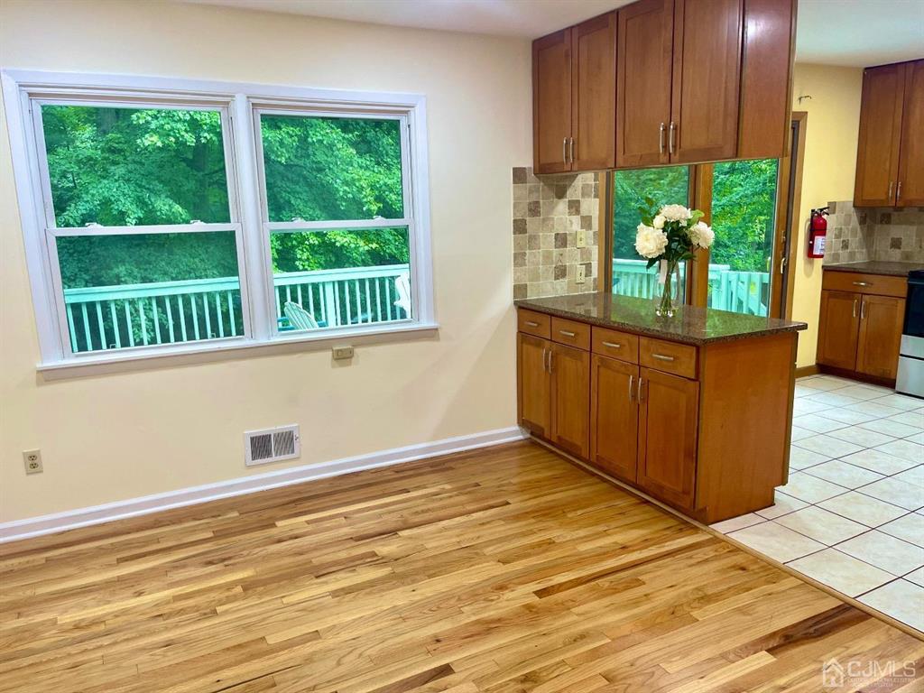 5 Greenwich Road Edison, NJ 08820 - Photo 29 of 52 a view of a kitchen with wooden floor and a window