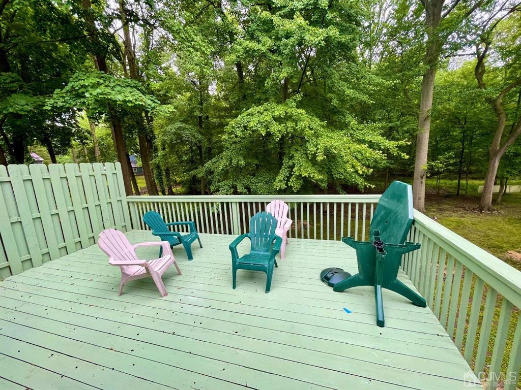 5 Greenwich Road Edison, NJ 08820 - Photo 9 of 52 a view of a deck with furniture and trees
