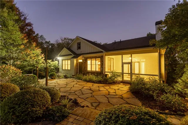 a front view of a house with garden