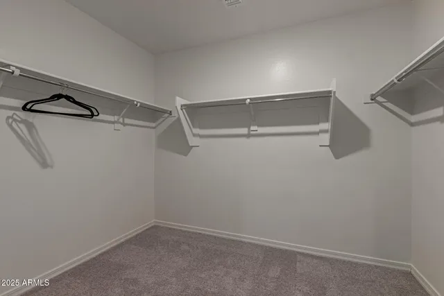 a bathroom with a toilet and shower