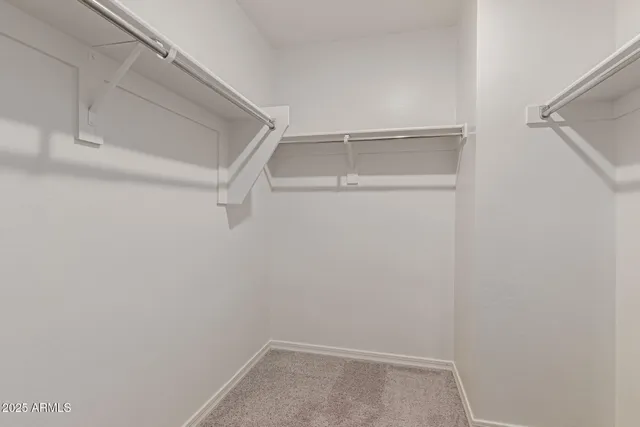 a bedroom with a bed and cabinets