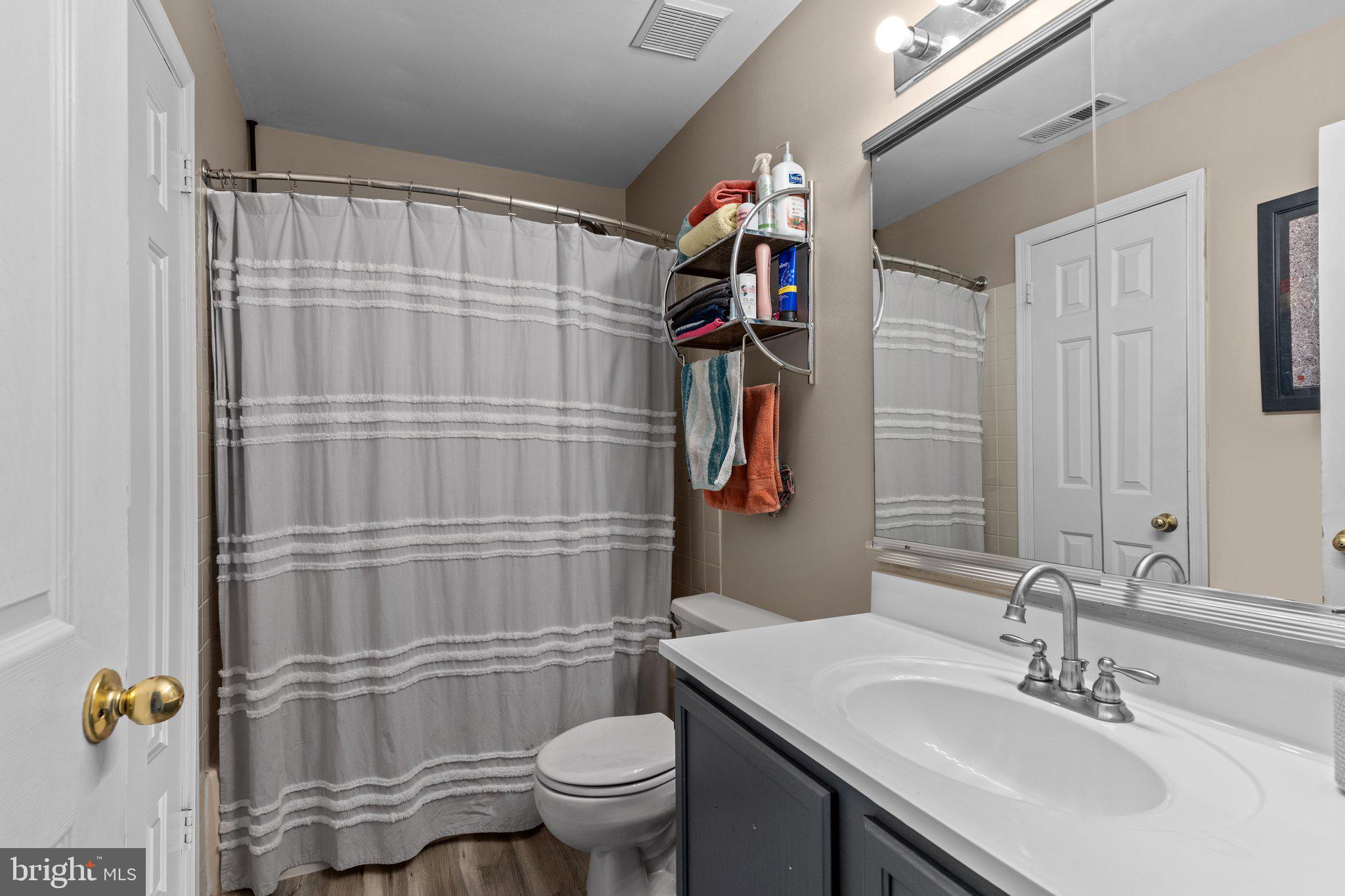 2404 Brookhaven Drive, Unit 330 Yardley, PA 19067 - Photo 11 of 27 a bathroom with a sink toilet and shower