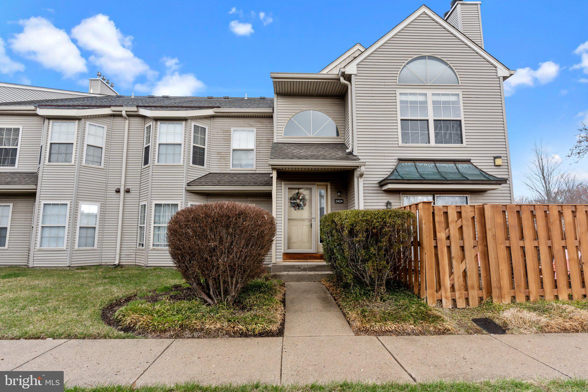 2404 Brookhaven Drive, Unit 330 Yardley, PA 19067 - Photo 2 of 27 a front view of a house with garden