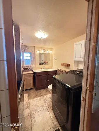 a kitchen with a stove a sink and a refrigerator