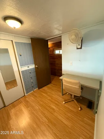 a room with a bed and furniture