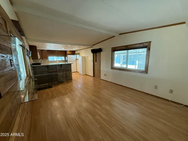 a room with wooden floors and furniture